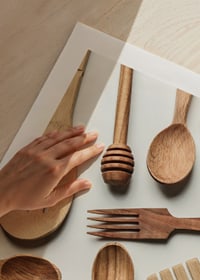 Photograph of various wooden kitchen utensils against a light background-9
