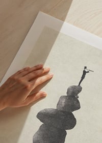 Illustration of man with binoculars on stacked stones, grayscale-9