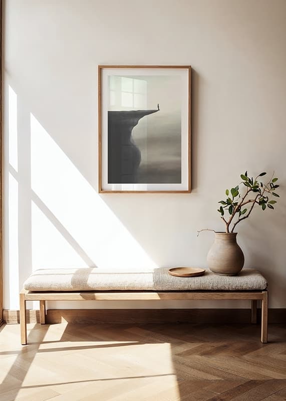 Minimalistisk illustration av person på klippavsats i grå toner-12