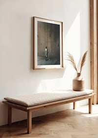 Surreal scene with man in coat and large key against brown wall-8