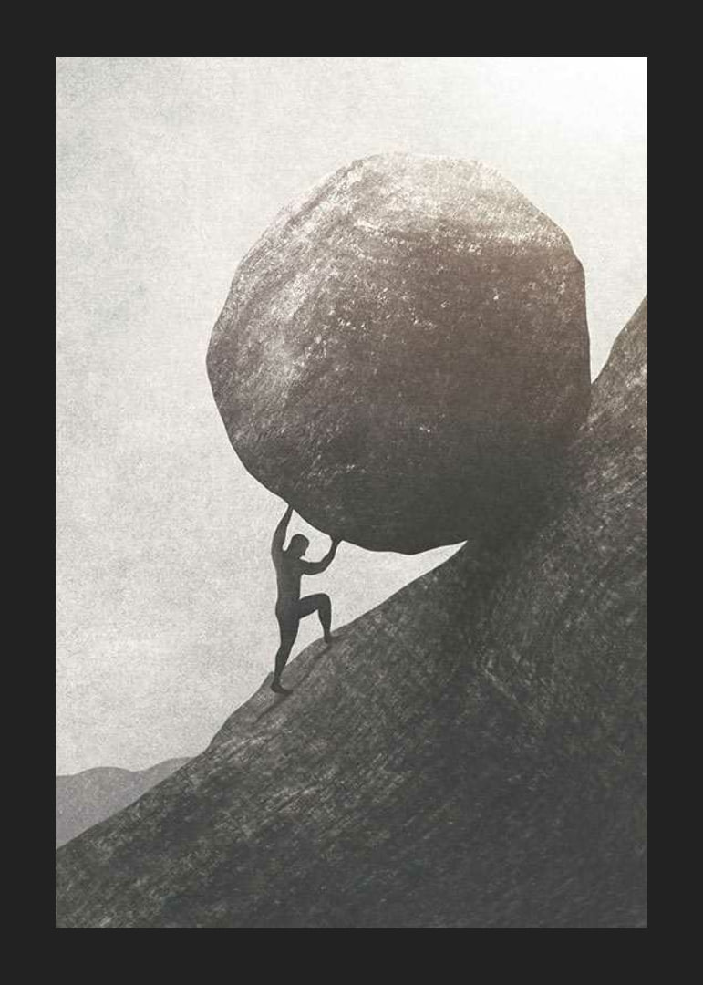 Silhouette of man pushing large rock up mountain slope-12