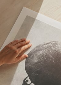 Silhouette of man pushing large rock up mountain slope-9