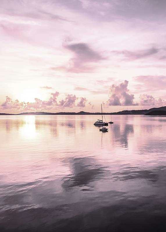 Photograph of sailboat on calm sea with purple sunset-12
