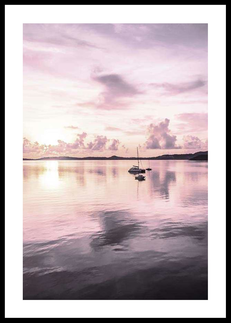 Photograph of sailboat on calm sea with purple sunset-12