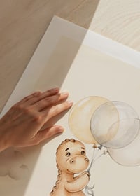Illustrated dinosaur with balloons among soft clouds-9