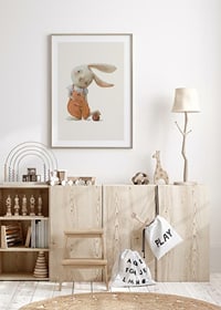 Illustrated hare in orange overalls with ball on light background-8