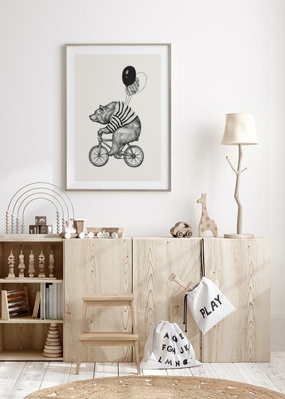 Illustrated bear with striped sweater on bike and balloons-12