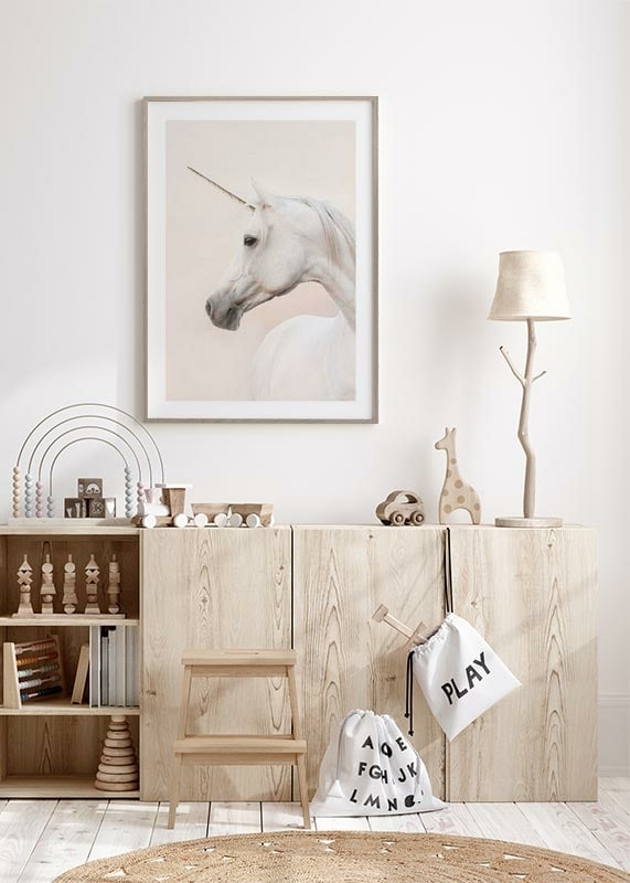 Close-up of white unicorn with long horn against light background-12