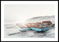 Photograph of two worn wooden boats on a light cliff-0