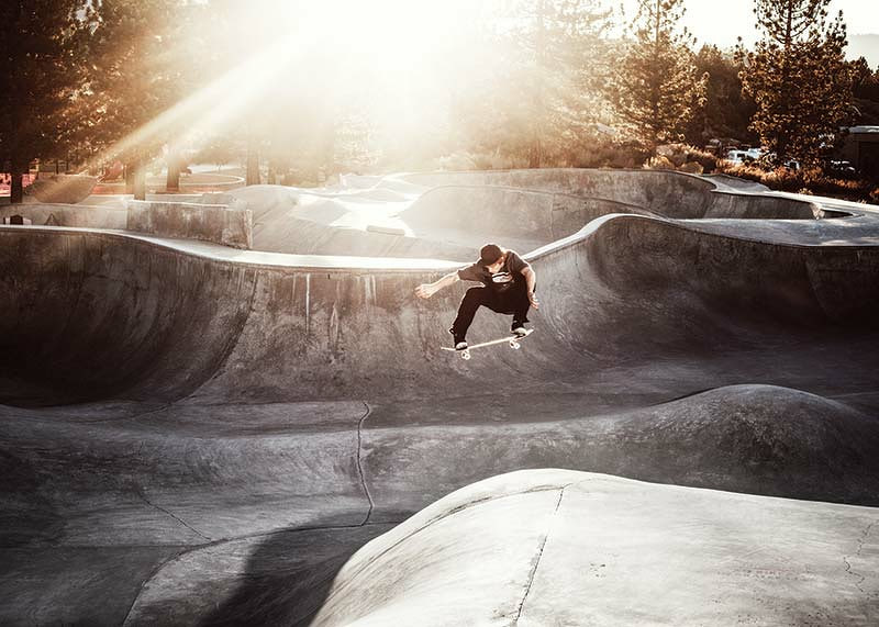 Photography of skateboarder in concrete park with backlight-12