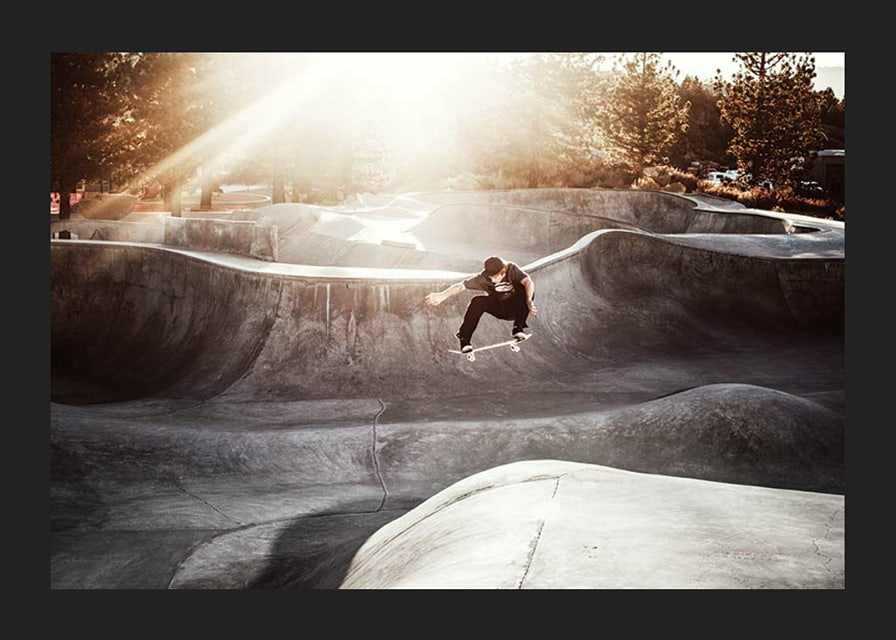 Photography of skateboarder in concrete park with backlight-12