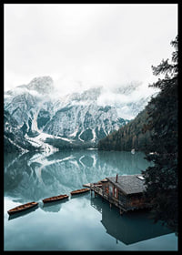 Photograph of snow-capped mountains, wooden pier and rowboats on a mirror-like lake-6