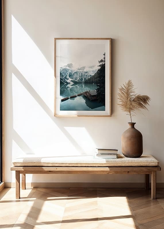 Photograph of snow-capped mountains, wooden pier and rowboats on a mirror-like lake-12