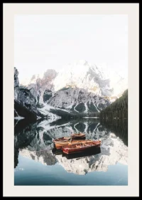 Photograph of rowboats on mirror-like lake, snow-capped mountains-2