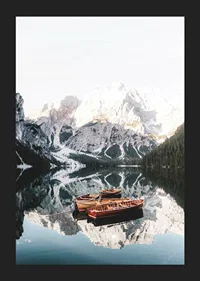 Photograph of rowboats on mirror-like lake, snow-capped mountains-5