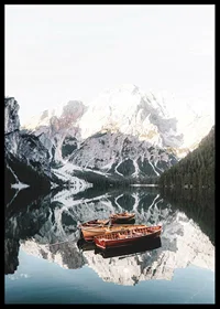 Photograph of rowboats on mirror-like lake, snow-capped mountains-6