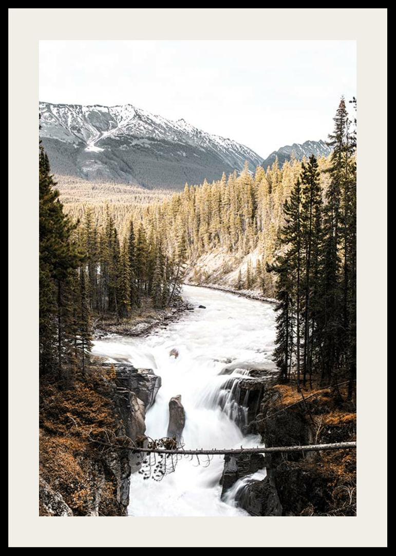 Photograph of cascading waterfall with pine forest and snow-capped mountains-12