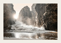 Photograph of waves crashing against rocks in soft backlight-3