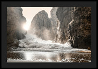 Photograph of waves crashing against rocks in soft backlight-4