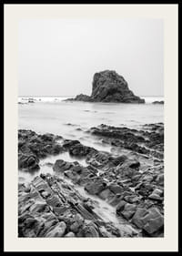 Black and white photography of dramatic sea cliffs and calm water-2