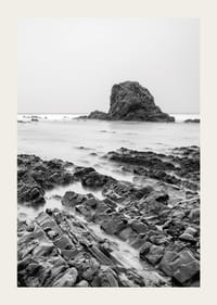 Black and white photography of dramatic sea cliffs and calm water-3