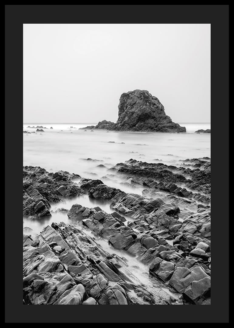 Black and white photography of dramatic sea cliffs and calm water-12