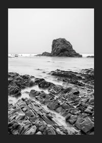 Black and white photography of dramatic sea cliffs and calm water-5