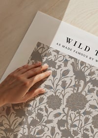 Stylized plant pattern with tulips and narrow leaves in beige and brown shades against a light background-3