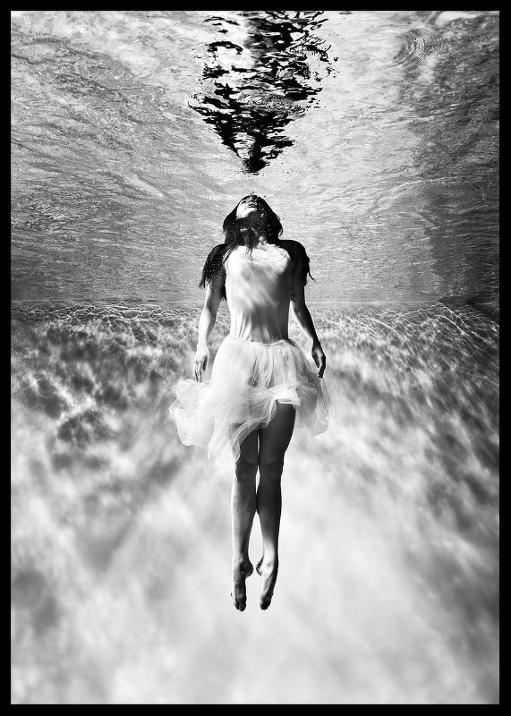 Black and white photo art of woman in dress under water surface-12