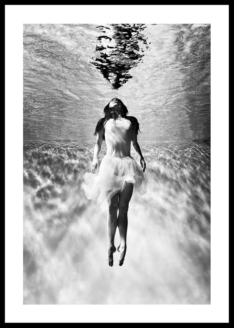 Black and white photo art of woman in dress under water surface-12