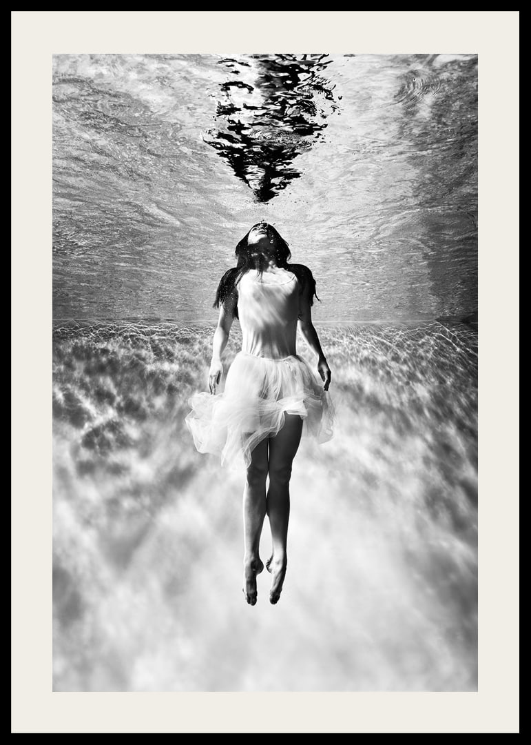 Black and white photo art of woman in dress under water surface-12