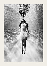 Black and white photo art of woman in dress under water surface-3