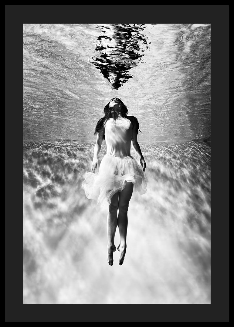 Black and white photo art of woman in dress under water surface-12