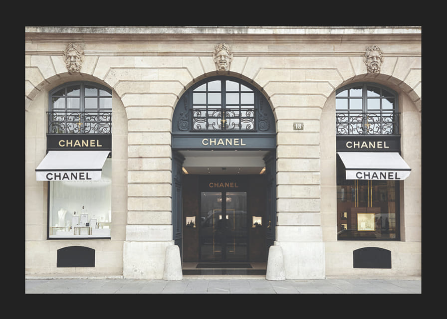 Photograph of Chanel store in classic stone building, light tones-12