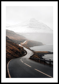 Photographic landscape with winding road, sea and snow-capped mountains-0