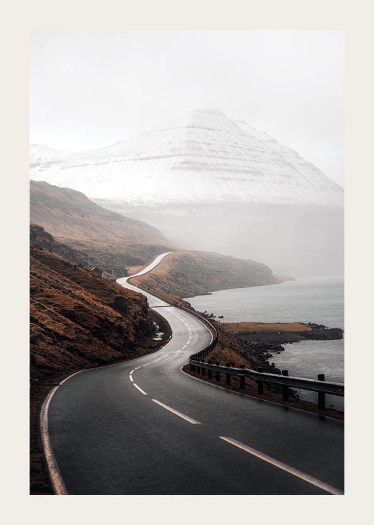Photographic landscape with winding road, sea and snow-capped mountains-12