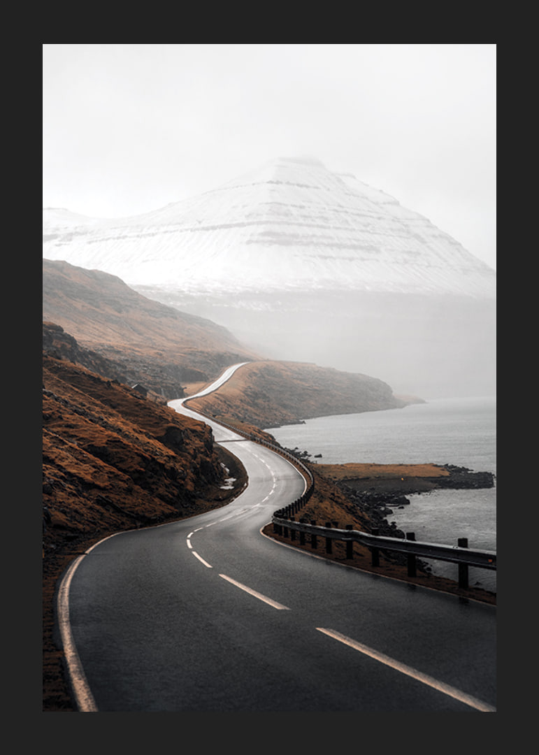 Photographic landscape with winding road, sea and snow-capped mountains-12