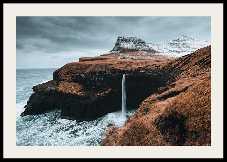 Photographic landscape with tall waterfall on barren coast-12