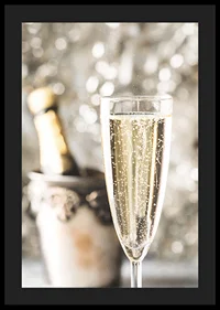 Photographic close-up of champagne glass with bubbles and blurred bottle in the background-4