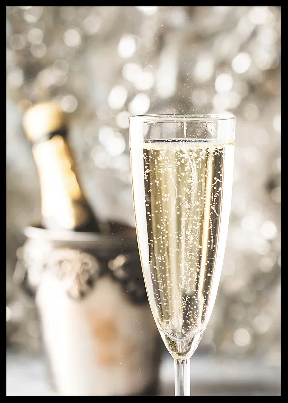 Photographic close-up of champagne glass with bubbles and blurred bottle in the background-12