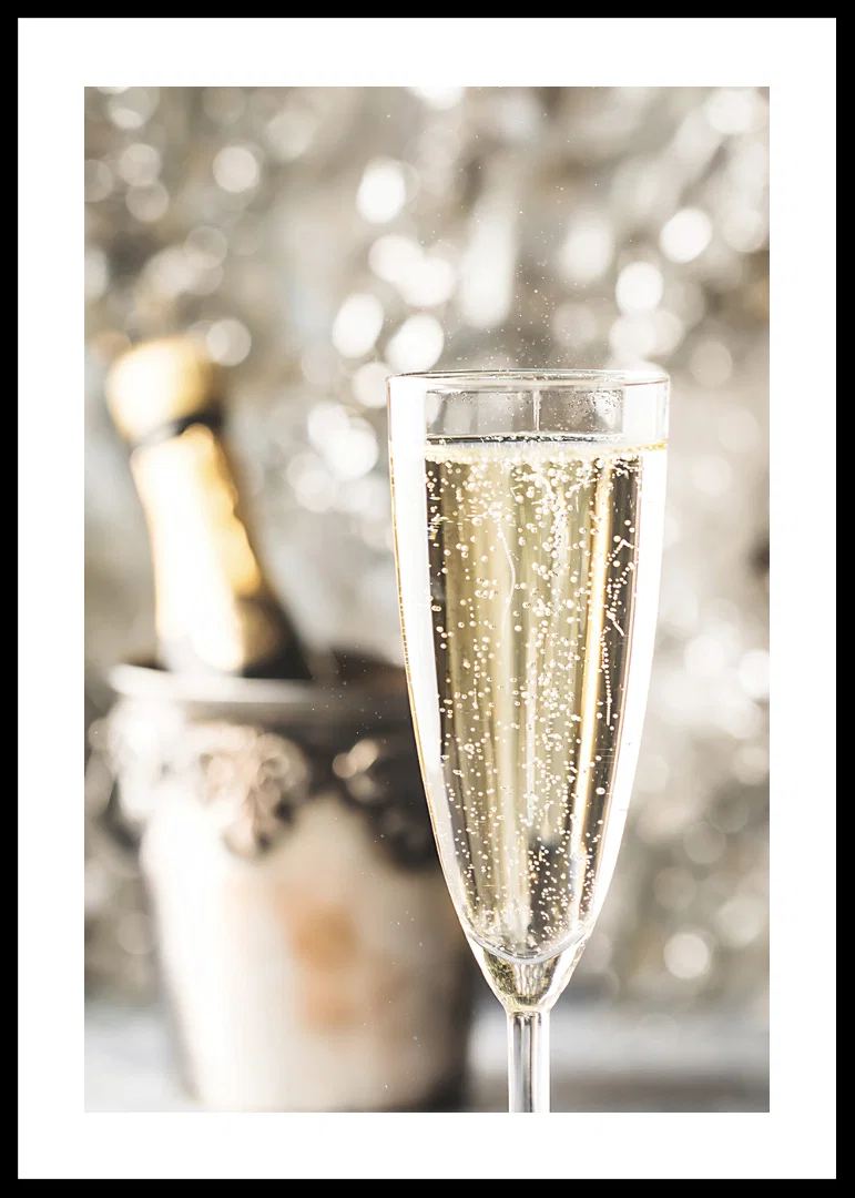 Photographic close-up of champagne glass with bubbles and blurred bottle in the background-12