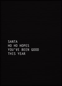 Svart letter board med vit jultext i enkel typografi-1
