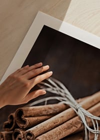 Close-up of cinnamon sticks in a bundle on dark wooden table-9