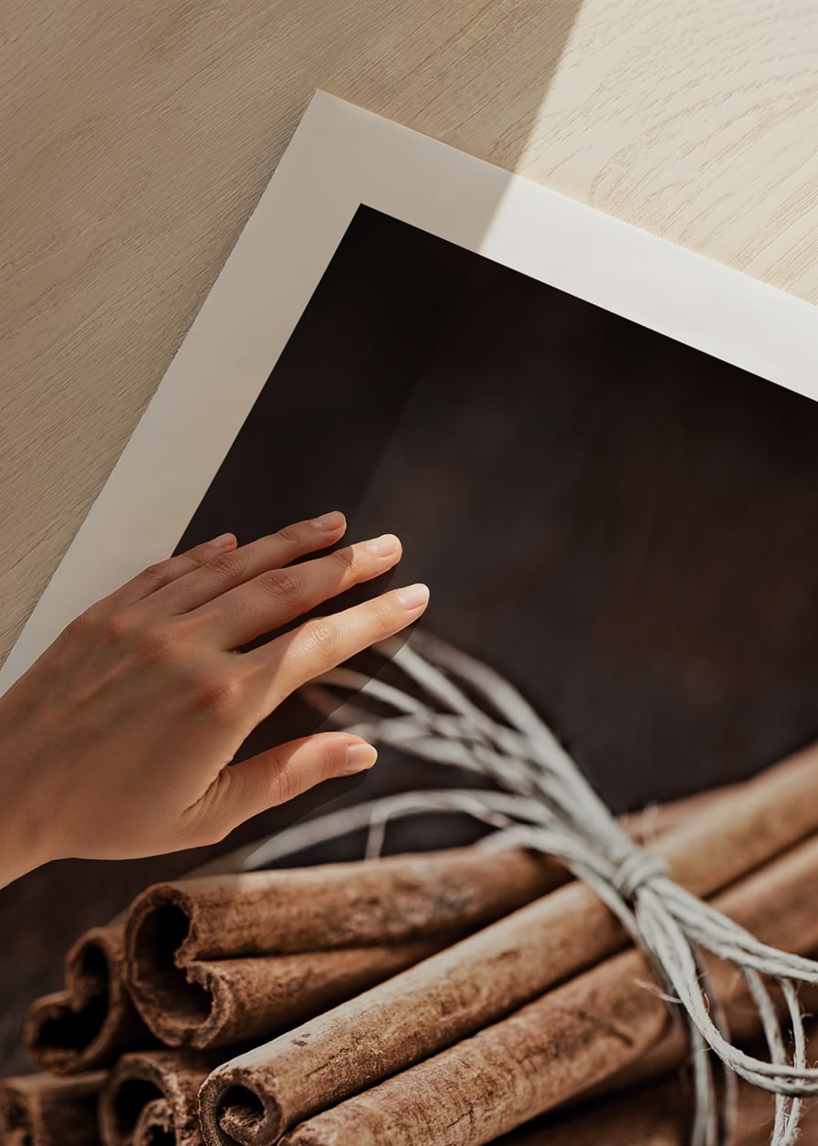 Close-up of cinnamon sticks in a bundle on dark wooden table-12