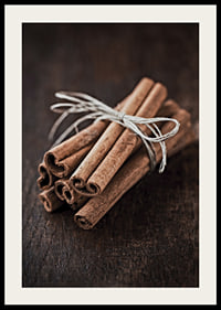 Close-up of cinnamon sticks in a bundle on dark wooden table-2