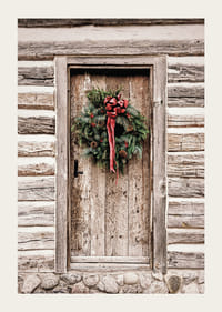 Fotografi af julekrans med rød sløjfe på en farvet trædør-3