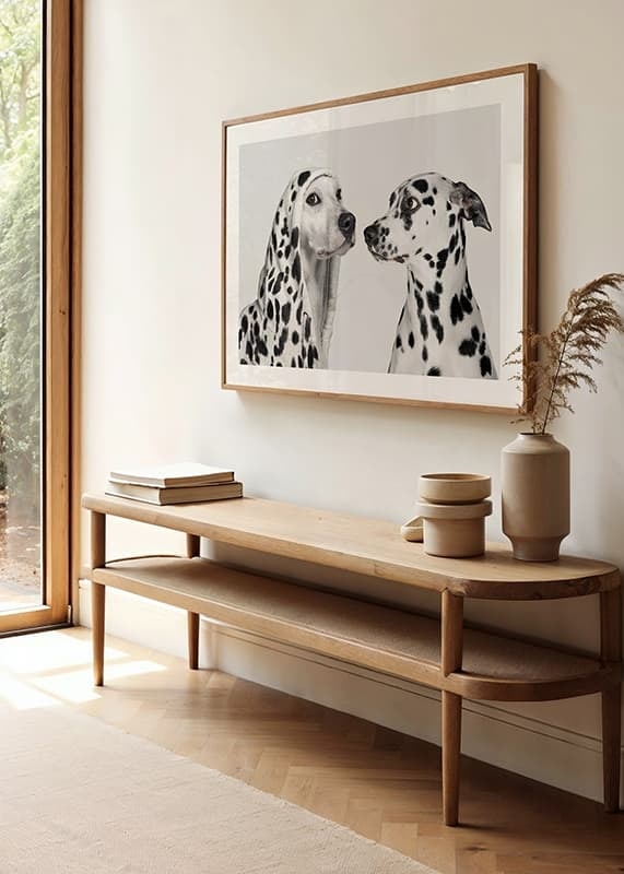 Two black and white dogs, one of which has a polka-dot hoodie-12