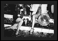 Black and white photograph of two women on party stairs with disco ball-4