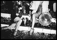 Black and white photograph of two women on party stairs with disco ball-6