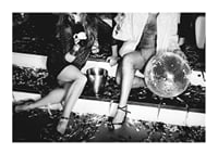 Black and white photograph of two women on party stairs with disco ball-1